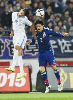 Japan defender Uchida in action in soccer friendly vs. Uzbekistan