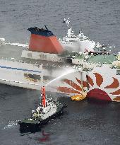 Fire fighting on ferry continues