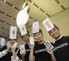 Apple's new iPhones go on sale in Japan