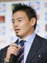 Japan rugby team returns home