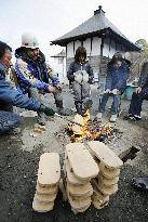 Burning monks' footware at disaster area