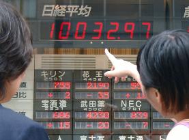 Nikkei ends above 10,000 on hopes for economic recovery