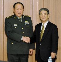Japanese, Chinese defense chiefs meet to deepen exchanges