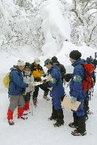 Patrol squad gives instructions to mountaineers at Mt. Daisen