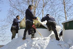 Hokkaido brewers unearth rice wine aged under snow