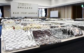 Kyoto police shows confiscated fake Louis Vuitton smartphone cases