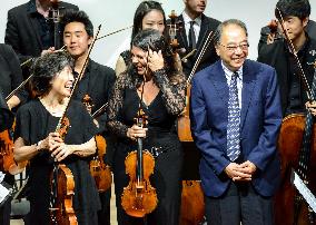 Japanese cellist Harada conducts for Ozawa academy's musicians