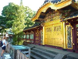 Main gate of grand shrine at Tokyo's Ueno Park glitters in gold