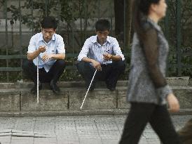 People of Pyongyang seen from bus window