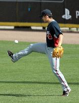 Atlanta pitcher Kawakami lets loose during practice