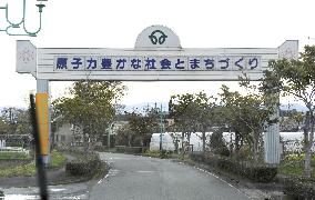 Evacuated Fukushima town to remove ironic nuclear signboards