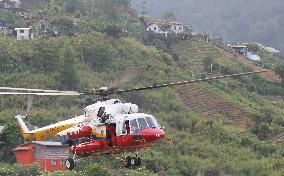 Helicopter heading to Malaysian mountain to recover bodies