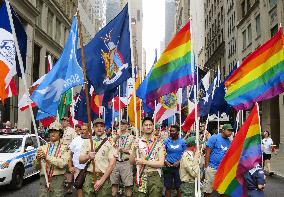 People carry rainbow flags in N.Y. parade for sexual minorities