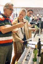 Visitors check Koshu brand of wine from Japan at Expo Milano