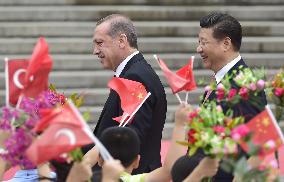 Turkish President Erdogan visits China, greeted by Xi