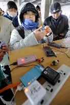 Cellphone chargers in quake-hit Ishinomaki