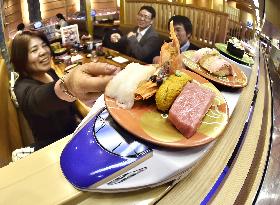 Toy Shinkansen train carries dishes at sushi-go-round shop