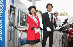 Fukuoka mayor pumps hydrogen made from sludge into car
