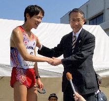 Japanese athlete breaks men's 20-km walk world record