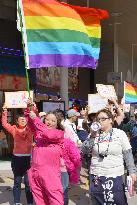 Lesbian waves rainbow flag for sexual minorities in Aomori, north Japan