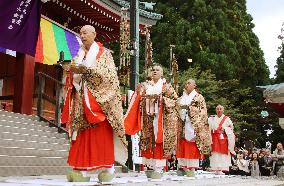 Tendai Buddhism priests walk around auditorium at Enryakuji