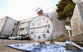 Clock removed from quake-hit school building in Miyagi Pref.