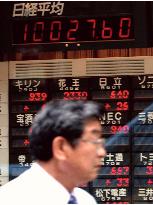 Nikkei briefly tops 10,000 on gains in techs