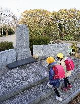 Schoolchildren visit former Imperial Japanese Army monument