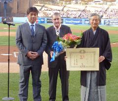 Ex-Dodgers owner O'Malley poses after being honored
