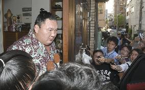 Hakuho's coach arrested over violence