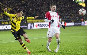 Japan MF Kagawa of Dortmund makes pass in game against Augsburg