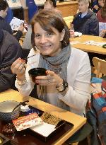 Woman tastes "miso" soup at Japanese pavilion in Expo Milano 2015