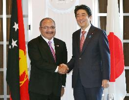 PMs of Japan, Papua New Guinea meet in Tokyo