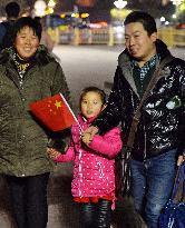 Chinese family visits Tiananmen Gate in Beijing