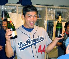 Saito gets 24th save as Dodgers secure playoff spot