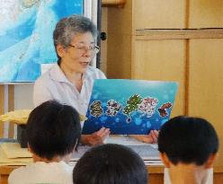 Ex-school teacher reads picture book about Takeshima