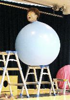 Japanese performer inside balloon