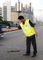 Cleaning up 'nail land mines' in Jakarta