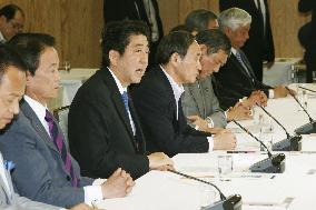 Japan's ruling bloc formally approves new security legislation