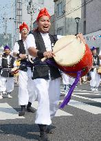 Okinawa-born resident in quake-hit north Japan city leads parade