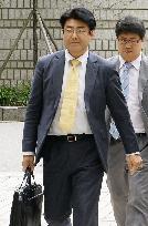 Indicted Japanese journalist enters Seoul court for hearing
