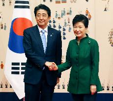 Abe, Park hold 1st talks amid row over "comfort women" issue