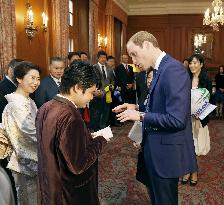Britain's Prince William meets blind Japanese pianist Tsujii