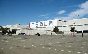 Tesla to make EV at new plant