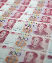 Chinese central bank devalues yuan