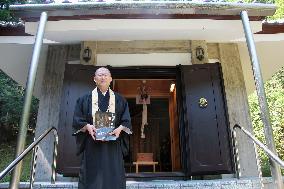 Priest of west Japan temple shows treasured Buddha statue
