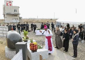 People of different religions mourn disaster victims