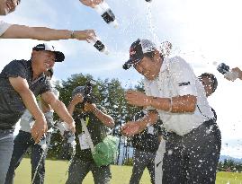 Muto congratulated after winning ISPS golf