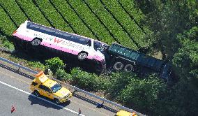 Lorry and coach crash off highway in central Japan