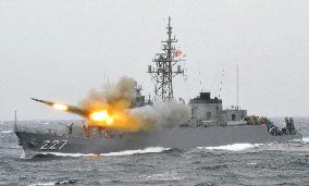 Japan destroyer test-fires missile at review